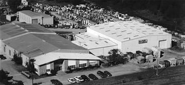 Aerial photograph of The Pump & Motor Works plant in Okmulgee, Oklahoma, with the motor yard behind the buildings