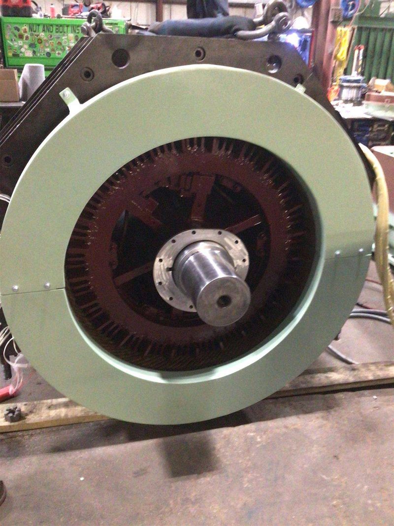 Rotor end view showing machined shaft and spider assembly on a workbench