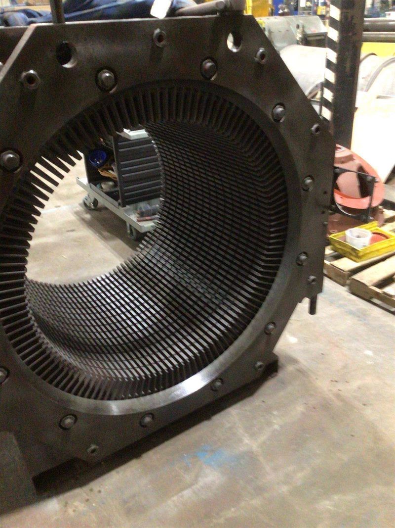 Stator frame with laminated core exposed after stripping the old windings