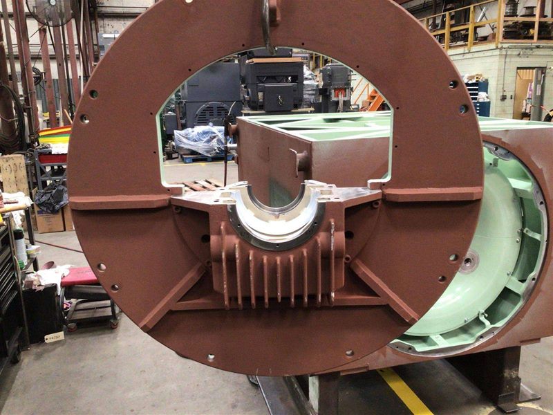 End frame and bearing housing showing machined bore and freshly painted housing