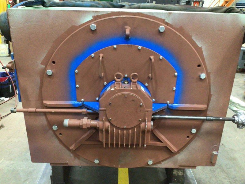 End bracket and bearing housing freshly painted in brown and blue